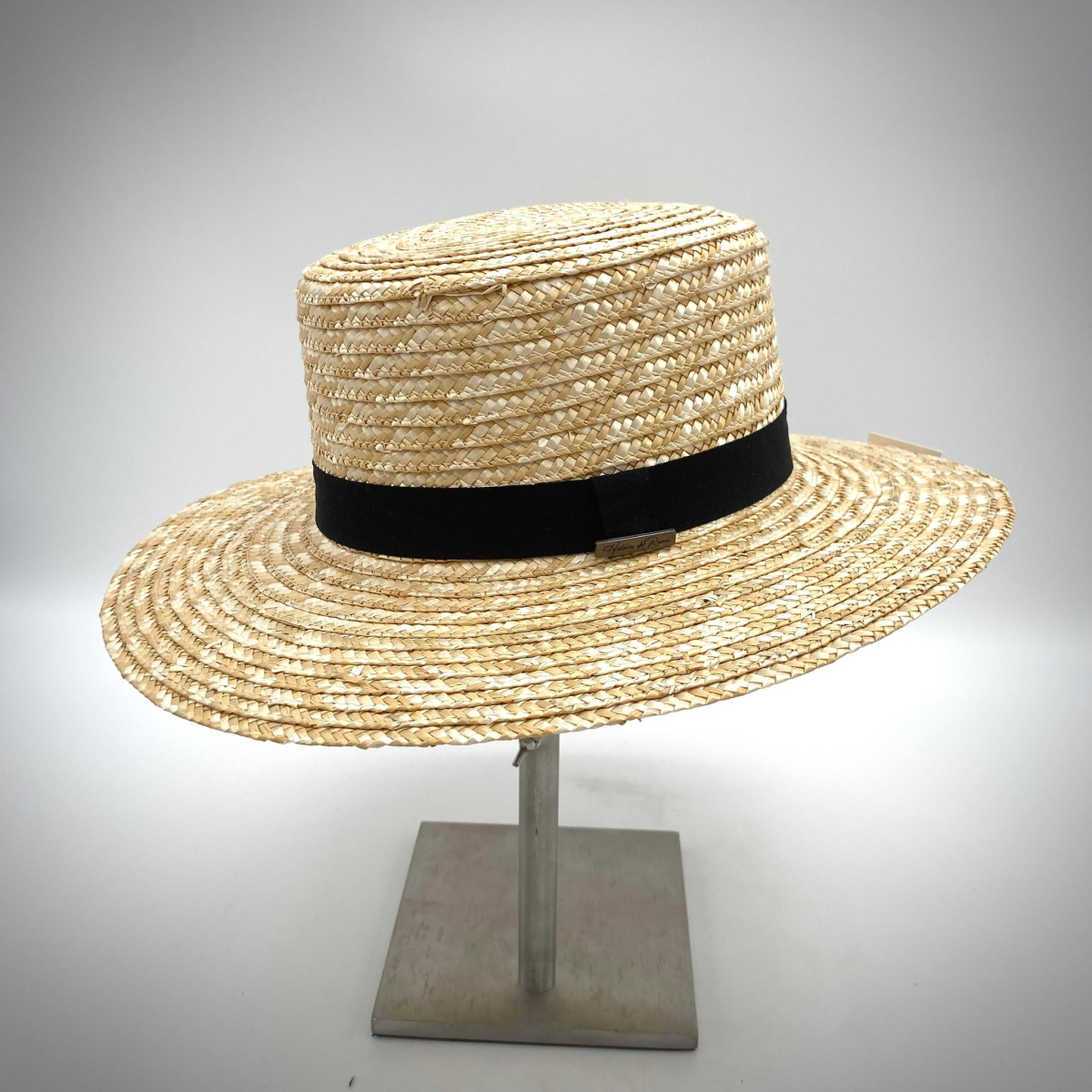 Straw hat with black fabric ribbon